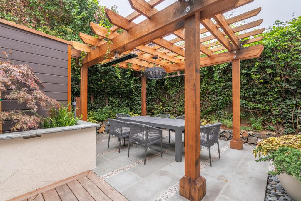 Terraced outdoor dining area with ipé hardwood deck at a Carmel residential landscape design project