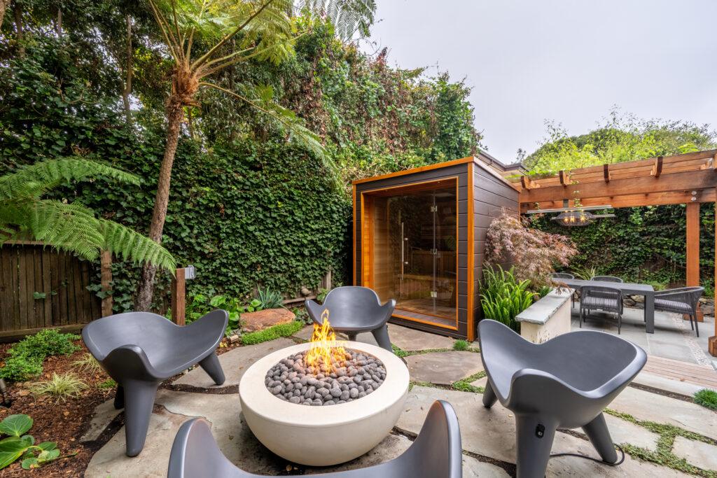Custom redwood arbor with surrounding plantings at the Carmel Zen Garden designed by Lewis Builders and Elemental Design